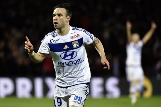 Lyon's French forward Mathieu Valbuena celebrates after scoring a goal during the French L1 football match Olympique Lyonnais (OL) vs Toulouse (TFC) on October 23, 2015, at the Gerland Stadium in Lyon, central-eastern France. AFP PHOTO / JEFF PACHOUD (Photo credit should read JEFF PACHOUD/AFP/Getty Images)