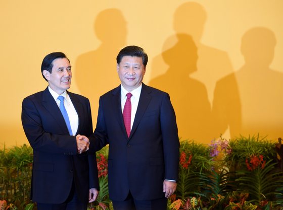 Chinese President Xi Jinping (R) shakes hands with Taiwan President Ma Ying-jeou before their meeting at Shangrila hotel in Singapore on November 7, 2015. The leaders of China and Taiwan hold a historic summit that will put a once unthinkable presidential seal on warming ties between the former Cold War rivals. AFP PHOTO / Roslan RAHMAN (Photo credit should read ROSLAN RAHMAN/AFP/Getty Images)