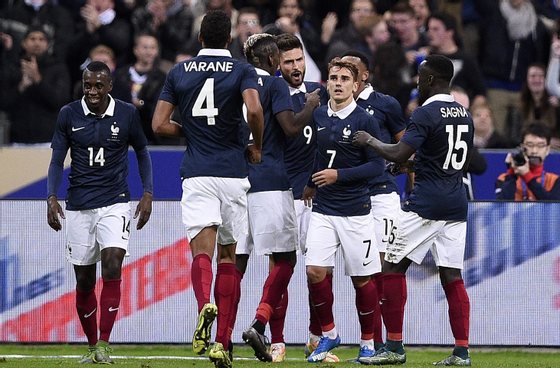 (From L) French midfielder Blaise Matuidi, French defender Raphael Varane, French midfielder Paul Pogba, French forward Olivier Giroud, French midfielder Antoine Griezmann and French defender Bacary Sagna celebrate after Giroud opened the scoring during a friendly international football match between France and Germany ahead of the Euro 2016, on November 13, 2015 at the Stade de France stadium in Saint-Denis, north of Paris. AFP PHOTO / FRANCK FIFE (Photo credit should read FRANCK FIFE/AFP/Getty Images)