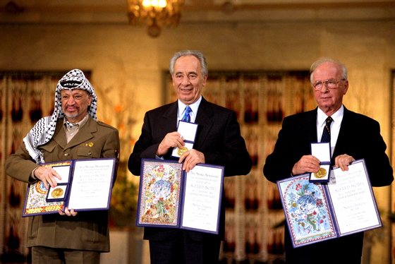 OSLO, NORWAY - 1994: In this handout from the Government Press Office, (R-L) Israeli Prime Minister Yitzak Rabin, Israeli Foreign Minister Shimon Peres and Palestinian leasder Yaser Arafat, the joint Nobel Peace Prize winners for 1994, in Olso, Norway. (Photo by Government Press Office via Getty Images) *** Local Caption *** Yitzak Rabin;Shimon Peres;Yaser Arafat