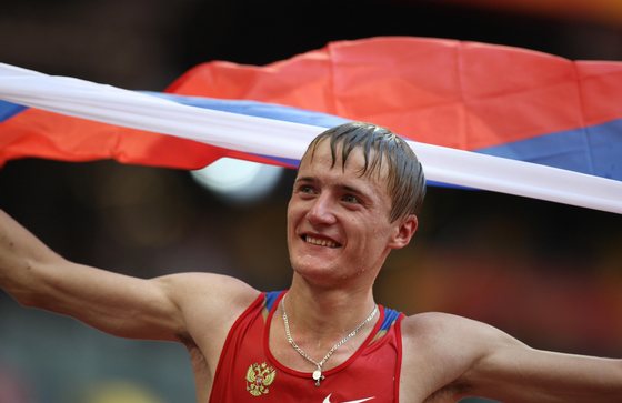 Russia's Valeriy Borchin celebrates after winning the men's 20km walk at the "Bird's Nest" National Stadium as part of the 2008 Beijing Olympic Games on August 16, 2008. Ecuador's Jefferson Perez and Australia's Jared Tallent came in second and third respectively. AFP PHOTO / VALERY HACHE (Photo credit should read VALERY HACHE/AFP/Getty Images)