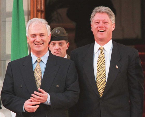 DUBLIN, IRELAND - DECEMBER 1: US President Bill Clinton (R) laughs with Irish Prime Minister John Bruton (L) 01 December before a meeting in which they discussed Bosnia and the Northern Ireland peace process. Clinton is on the first day of a two-day visit to Ireland. AFP PHOTO (Photo credit should read PATRICK KOVARIK/AFP/Getty Images)