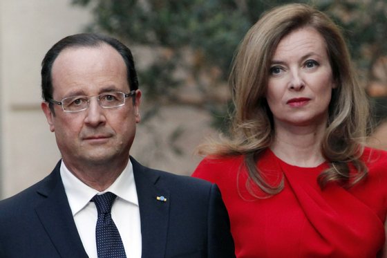French President Francois Hollande and his companion Valerie Trierweiler arrive for a state dinner at the Elysee presidential palace in Paris on May 7, 2013, as part of Poland's president two-day visit to France. AFP PHOTO / POOL / Thibault Camus (Photo credit should read THIBAULT CAMUS/AFP/Getty Images)