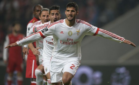 Benfica's Argentinian defender Lisandro Lopez (R) celebrates after scoring a goal during the Portuguese league football match Sporting Braga vs SL Benfica at the Municipal stadium of Braga on November 30, 2015. AFP PHOTO/ MIGUEL RIOPA / AFP / MIGUEL RIOPA (Photo credit should read MIGUEL RIOPA/AFP/Getty Images)