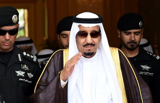 Saudi King Salman bin Abdulaziz (C) walks out to receive Sheikh Mohammed Bin Rashid al-Maktoum, ruler of Dubai (unseen) upon his arrival to attend the Gulf Cooperation Council (GCC) summit in Riyadh on May 5, 2015. AFP PHOTO / FAYEZ NURELDINE (Photo credit should read FAYEZ NURELDINE/AFP/Getty Images)