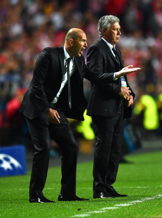 LISBON, PORTUGAL - MAY 24: Head Coach, Carlo Ancelotti of Real Madrid looks on as Assistant coach Zinedine Zidane of Real Madrid as he shouts instructions during the UEFA Champions League Final between Real Madrid and Atletico de Madrid at Estadio da Luz on May 24, 2014 in Lisbon, Portugal. (Photo by Shaun Botterill/Getty Images)