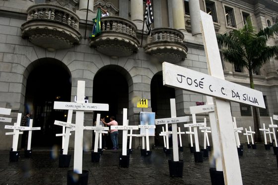 Crosses are seen in front of the School of Law of the University of Sao Paulo (USP) in homage to the inmates dead at the Carandiru Penitentiary massacre in Sao Paulo, Brazil on April 8, 2013. Twenty-six military police officers were to go on trial here Monday for the alleged execution-style killing of inmates during Brazil's deadliest prison uprising, which claimed the lives of 111 prisoners.AFP PHOTO / Nelson ALMEIDA (Photo credit should read NELSON ALMEIDA/AFP/Getty Images)
