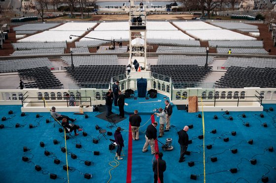 WASHINGTON, DC - JANUARY 19: Workers prepare the platform stage on the West Front of the U.S. Capitol one day before the presidential inauguration, January 19, 2017 in Washington. DC. Trump will be inaugurated as the 45th U.S. President on Friday. (Photo by Drew Angerer/Getty Images)
