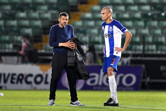 FC Portoâ€™s head coach Sergio Conceicao (L) reacts next to his player Pepe during their Portuguese First League soccer match with Pacos de Ferreira, held at Capital do Movel stadium, in PaÃ§os de Ferreira, north of Portugal, 29 June 2020. OCTAVIO PASSOS/POOL/LUSA