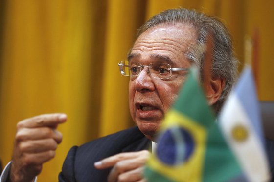 epa07824116 Brazilian Minister of Economy Paulo Guedes speaks during a press conference after a meeting with the Minister of Production and Labor of Argentina, Dante Sica, in Rio de Janeiro, Brazil, 06 September 2019. Both nations again postponed the date for the start of bilateral free trade on cars. It will be now by 2029, in an agreement signed Friday that establishes "more stable rules" for the exchange and despite reaffirming their commitment to economic opening. Automobile trade is one of the main exceptions within the Mercosur free trade block, and is regulated by bilateral and non-multilateral agreements. EPA/MARCELO SAYAO