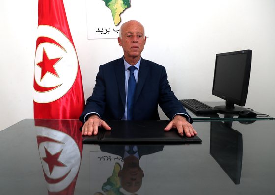 epa07846950 Tunisian presidential candidate Kais Saied poses for a photo at his campaign headquarters in Tunis, Tunisia, 16 September 2019. According to reports, preliminary results showed presidential candidates Kais Said, a 61-year-old law professor, and imprisoned businessman Nabil Karoui are leading the first round of voting and expected to face off in the second round in October. EPA/MOHAMED MESSARA