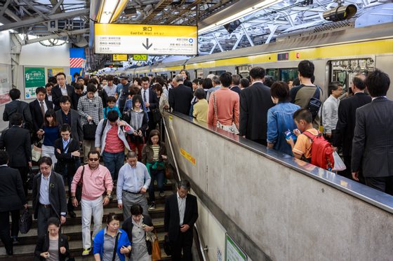 Commuters exit the platform at Shinjuku station, said to be