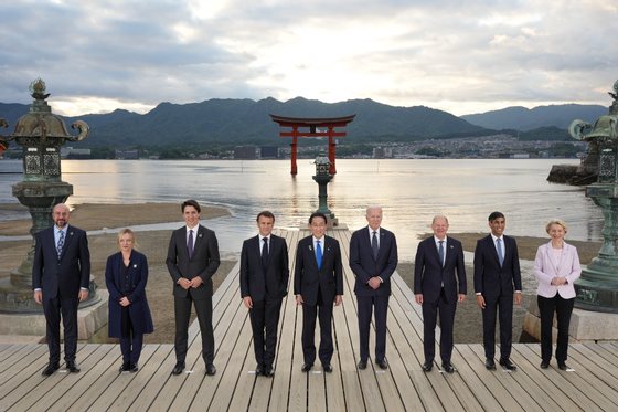 epa10638593 A handout photo made available by the G7 Hiroshima Summit Host shows (L-R) European Council President Charles Michel, Italian Prime Minister Giorgia Meloni, Canadian Prime Minister Justin Trudeau, French President Emmanuel Macron, Japanâ€™s Prime Minister Fumio Kishida, US President Joe Biden, German Chancellor Olaf Scholz, British Prime Minister Rishi Sunak and European Commission President Ursula von der Leyen posing for a group photo at the Itsukushima Shrine on Miyajima island during the G7 Hiroshima Summit in Hiroshima, Japan, 19 May 2023. The G7 Hiroshima Summit will be held from 19 to 21 May 2023.  EPA/G7 Hiroshima Summit Host / HANDOUT  HANDOUT EDITORIAL USE ONLY/NO SALES