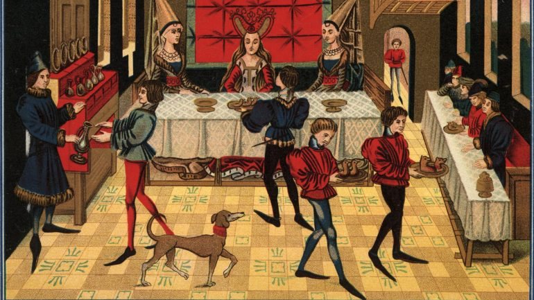 Pormenor de ilustração do livro do herói Renaud de Montauban que retrata um banquete cerca de 1450.