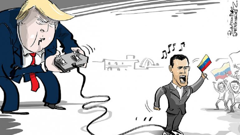 Na caricatura publicada pela agência noticiosa russa Sputnik Trump comanda Guaidó