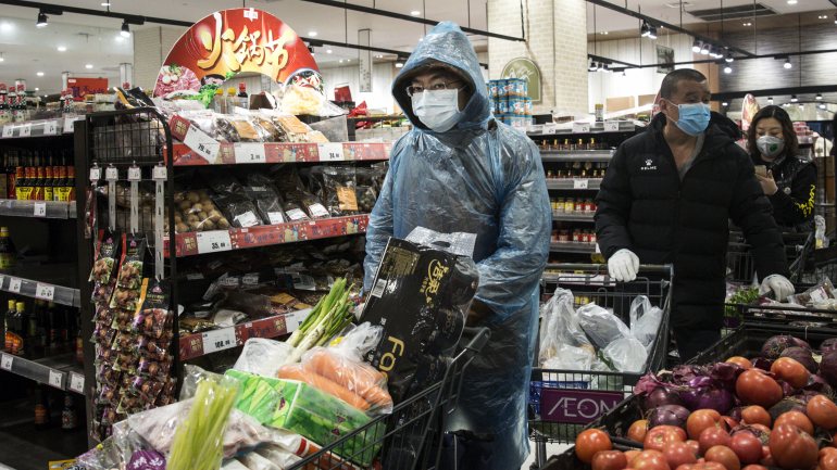 WUHAN, CHINA - FEBRUARY 12:  (CHINA OUT) Residents wear protective masks as they line up in the supermarket on February 12, 2020 in Wuhan, Hubei province, China. Flights, trains and public transport including buses, subway and ferry services have been closed for 21 days. The number of those who have died from the Wuhan coronavirus, known as 2019-nCoV, in China climbed to 1117.  (Photo by Stringer/Getty Images)