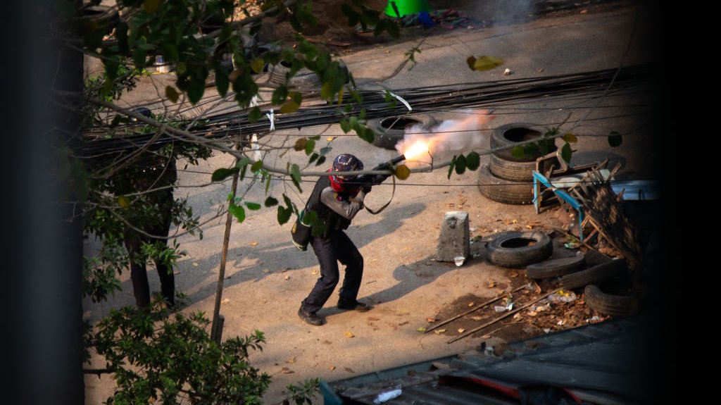 Myanmar police seen shooting with 38 mm grenade launcher at