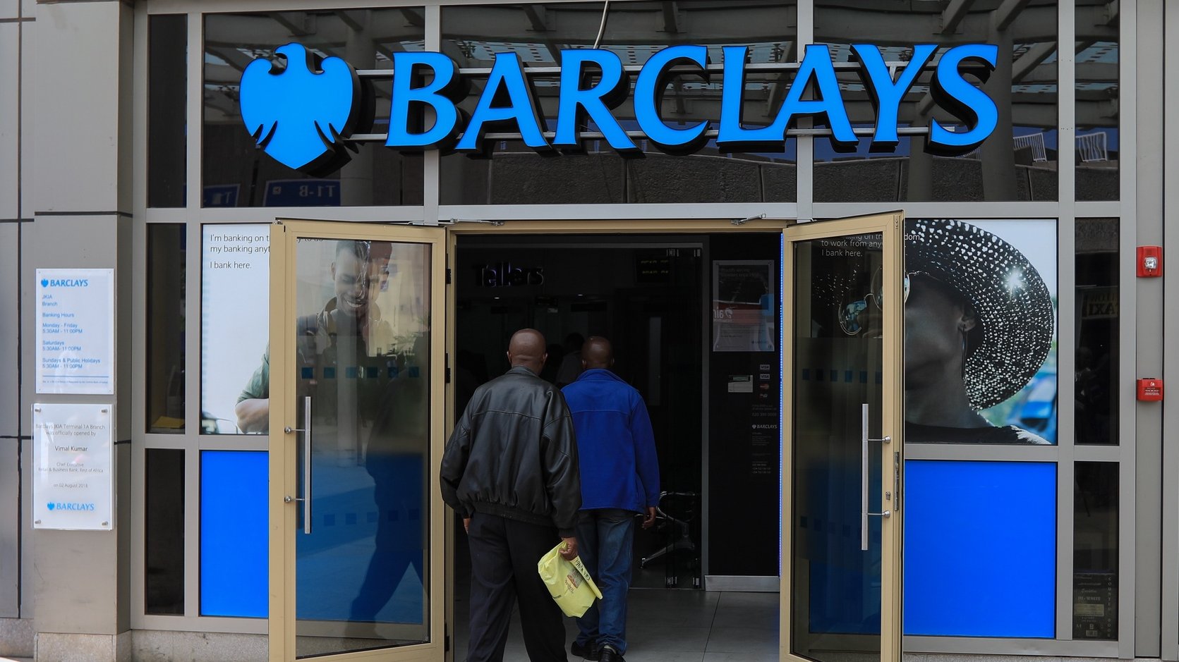 epa08215391 (FILE) - People enter into a Barclays bank branch located at the entrance of one of the international arrivals terminals at the Jomo Kenyatta International Airport (JKIA) in Nairobi, Kenya, 06 March 2019 (reissued 13 February 2020). Barclays on 13 February 2020 released their full year 2019 results, saying the Barclay Group&#039;s total 2019 income was 21,632 million pound, net operating income was 19,720 million pound and profit after tax stood at 3,354 million pound.  EPA/DANIEL IRUNGU *** Local Caption *** 55036163