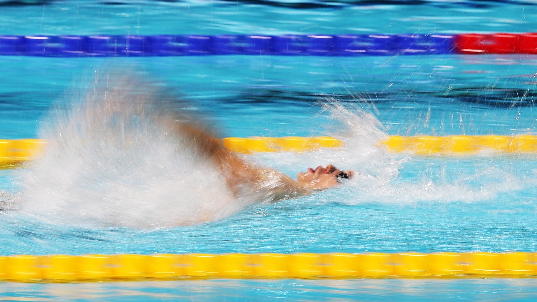 epa09644489 Roman Mityukov of Switzerland competes in the heats of the Men&#039;s 100m Backstroke at the 15th FINA World Swimming Championships (25m), Abu Dhabi, United Arab Emirates, 16 December 2021.  EPA/ALI HAIDER