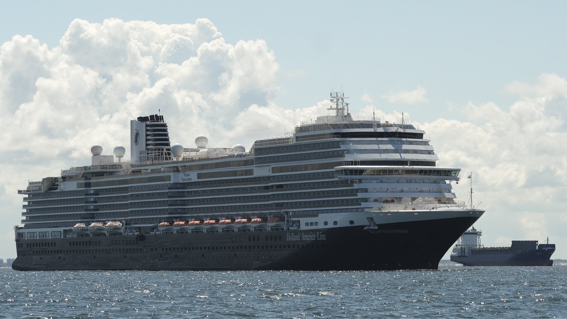 epa08540863 Ms Nieuw Statendam of Holland America Line and several passenger vessels anchored off the coast in one of the mooring area, off the Netherlands coast near Scheveningen, 11 July 2020. Following Covid-19 outbreak cruise ship industy are not yet resuming activities. Ms Nieuw Statendam usually carried 2666 passenger and employs a crew of 1036 people.  EPA/OLIVIER HOSLET