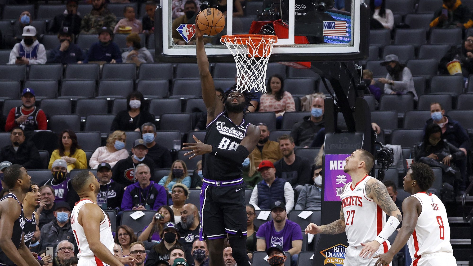 epa09686445 Sacramento Kings center Neemias Queta of Portugal (C) goes under the basket for two points against the Houston Rockets during the first half of the NBA game at Golden 1 Center in Sacramento, California, USA, 14 January 2022.  EPA/JOHN G. MABANGLO  SHUTTERSTOCK OUT