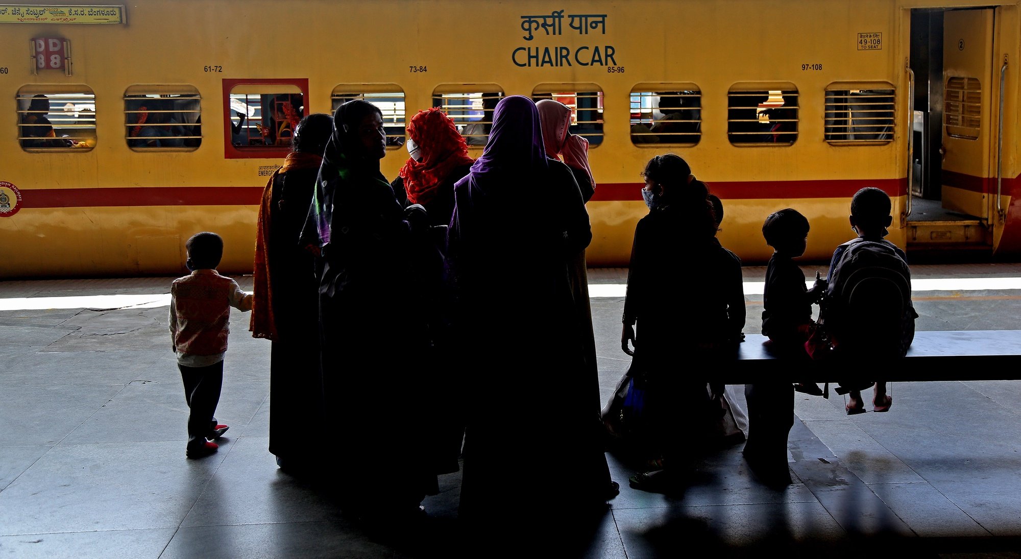 epa08979557 Commuters wait at the city railway station in Bangalore, India 01 February 2021. India union budget presented by the Union Finance Minister Nirmala Sitharaman her first paperless Union budget amid COVID19 pandemic making it the most significant budget to boost economic growth, a slew of measures on healthcare and infrastructure to give an impetus to the Covid-hit economy.  EPA/JAGADEESH NV