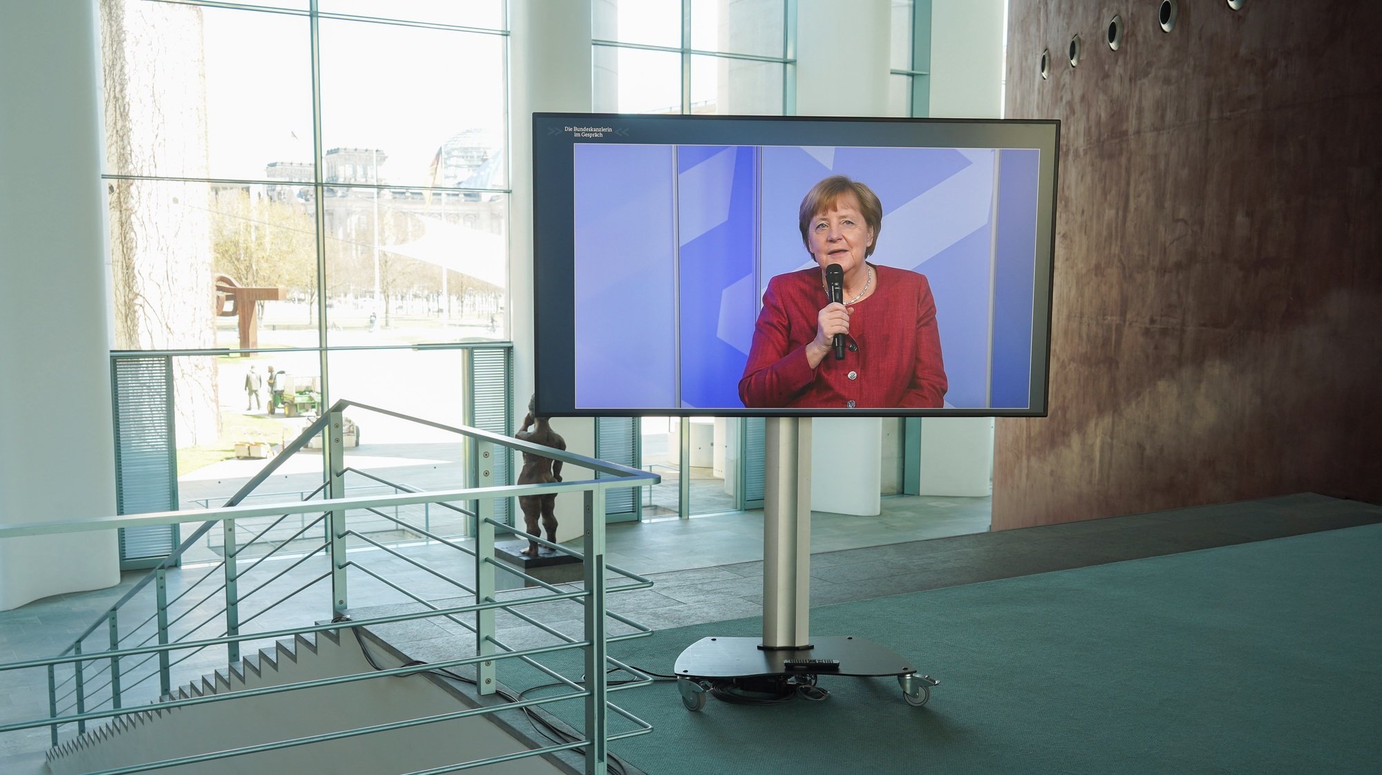 epa09163316 German Chancellor Angela Merkel (on screen) speaks during the digital dialogue series &#039;in conversation with the German Chancellor&#039;, in Berlin, Germany, 27 April 2021.  EPA/JOERG CARSTENSEN / POOL