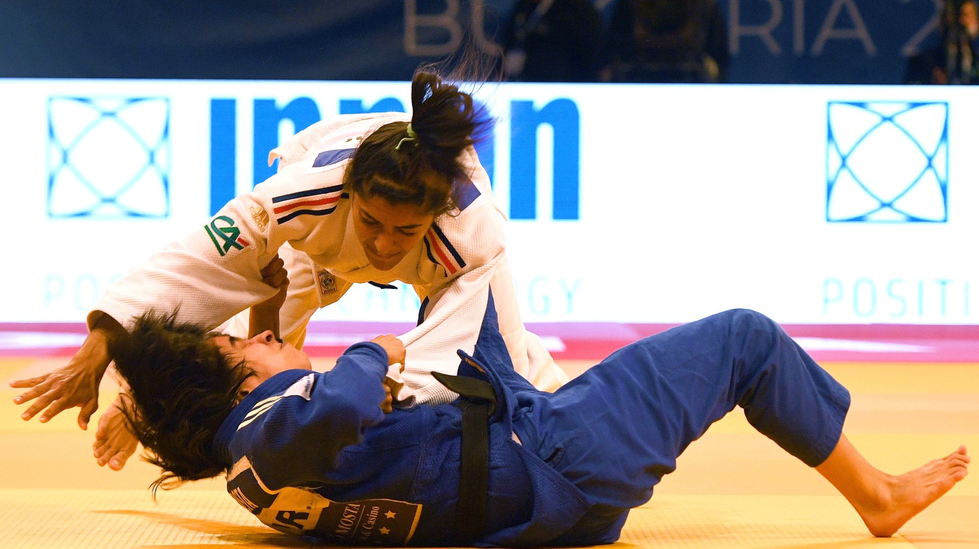 epa09916549 Shirine Boukli (up) of France competes against Catarina Costa (bottom) of Portugal during their women&#039;s 48kg category final of the European Judo Championships in Sofia, Bulgaria, 29 April 2022.  EPA/VASSIL DONEV