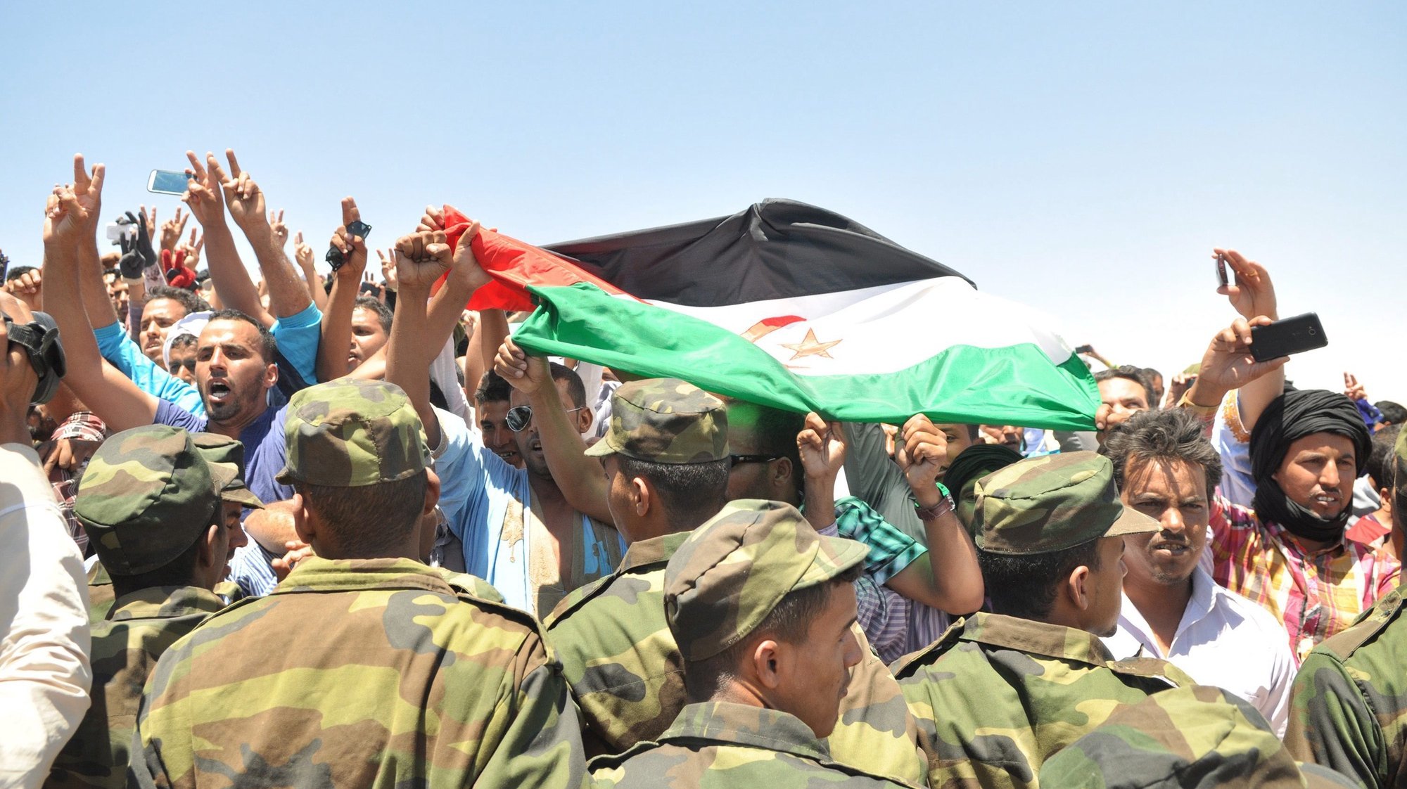 epa05344596 Soldiers and sympathisers gather for a remembrance ceremony of late Sahrawi Mohamed Abdelaziz, President of the Sahrawi Arab Democratic Republic (RASD), at the airport in Tindouf, Algeria, 03 June 2016. Mohamed Abdelaziz, in his late sixties, died after a long battle with illness on 31 May. He was the secretary general of the Polisario Front, a movement fighting for independence of the largely desert region of Western Sahara. The Algerian Prime Minister Abdelmalek Sellal and other member of Algerian government were present to pay their last tribute. Sahrawi&#039;s funeral is expected to take place at Bir Lahlou, a town northeast of Western Sahara, in the area controlled by the Polisario Front, located 236 kilometers from Smara, on 04 June 2016.  EPA/STR