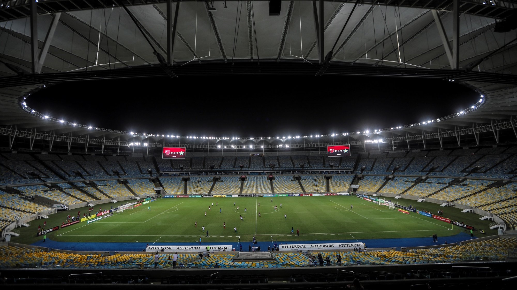 epa08294895 General view of the Maracana without fans during the game between Flamengo Vs. Portuguesa for the Rio de Janeiro soccer championship, in the empty Maracana stadium, in Rio de Janeiro, Brazil, 14 March 2020. The soccer matches scheduled for today and tomorrow in most Brazilian stadiums, including Rio de Janeiro and Sao Paulo, will be behind closed doors, over fears that large public gatherings will facilitate the expansion of the coronavirus in Brazil.  EPA/Antonio Lacerda