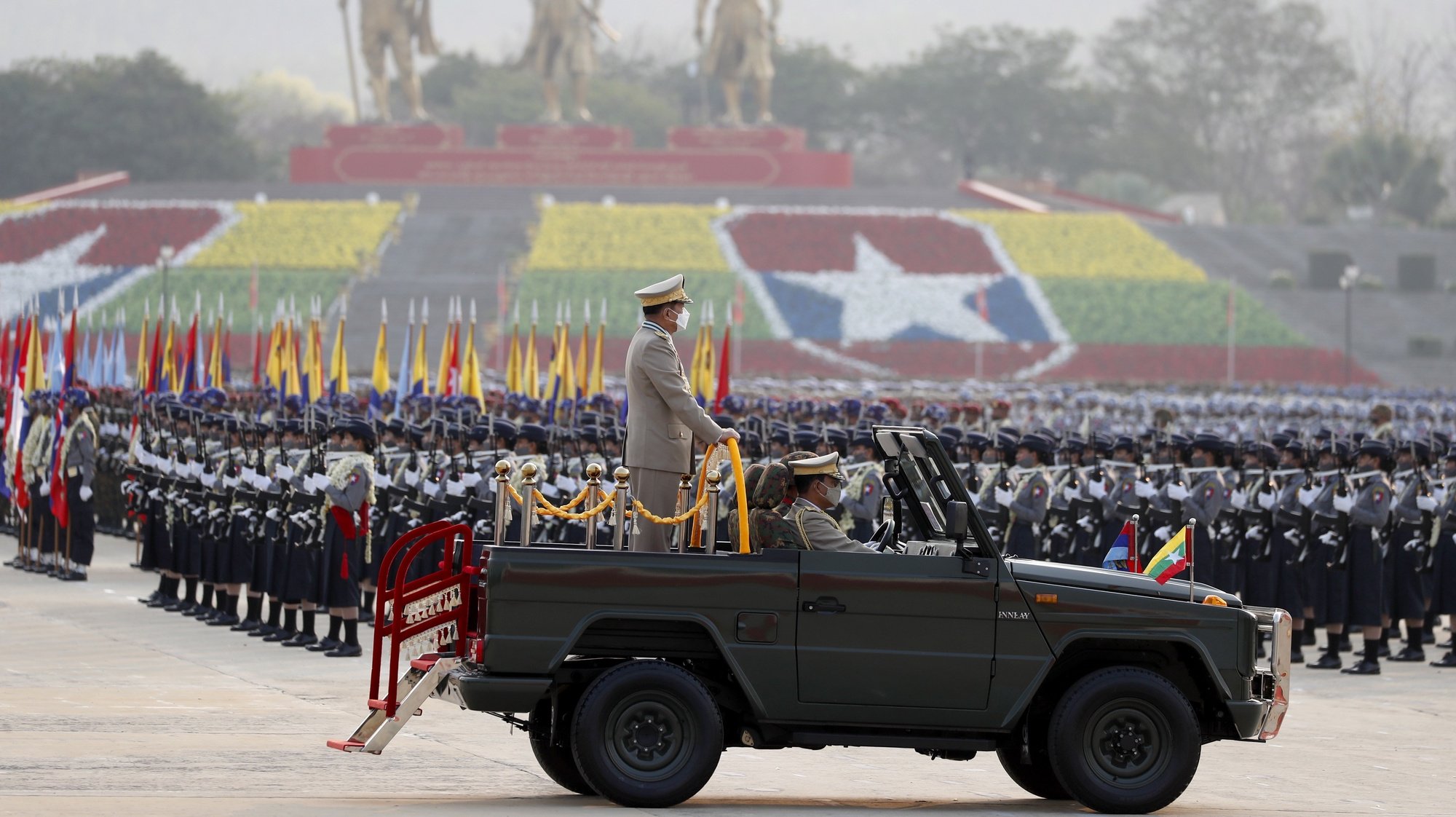 epa09852333 Myanmar military Commander-in-Chief Senior General Min Aung Hlaing (C) participates in a parade during the 77th Armed Forces Day in Naypyidaw, Myanmar, 27 March 2022.  EPA/NYEIN CHAN NAING