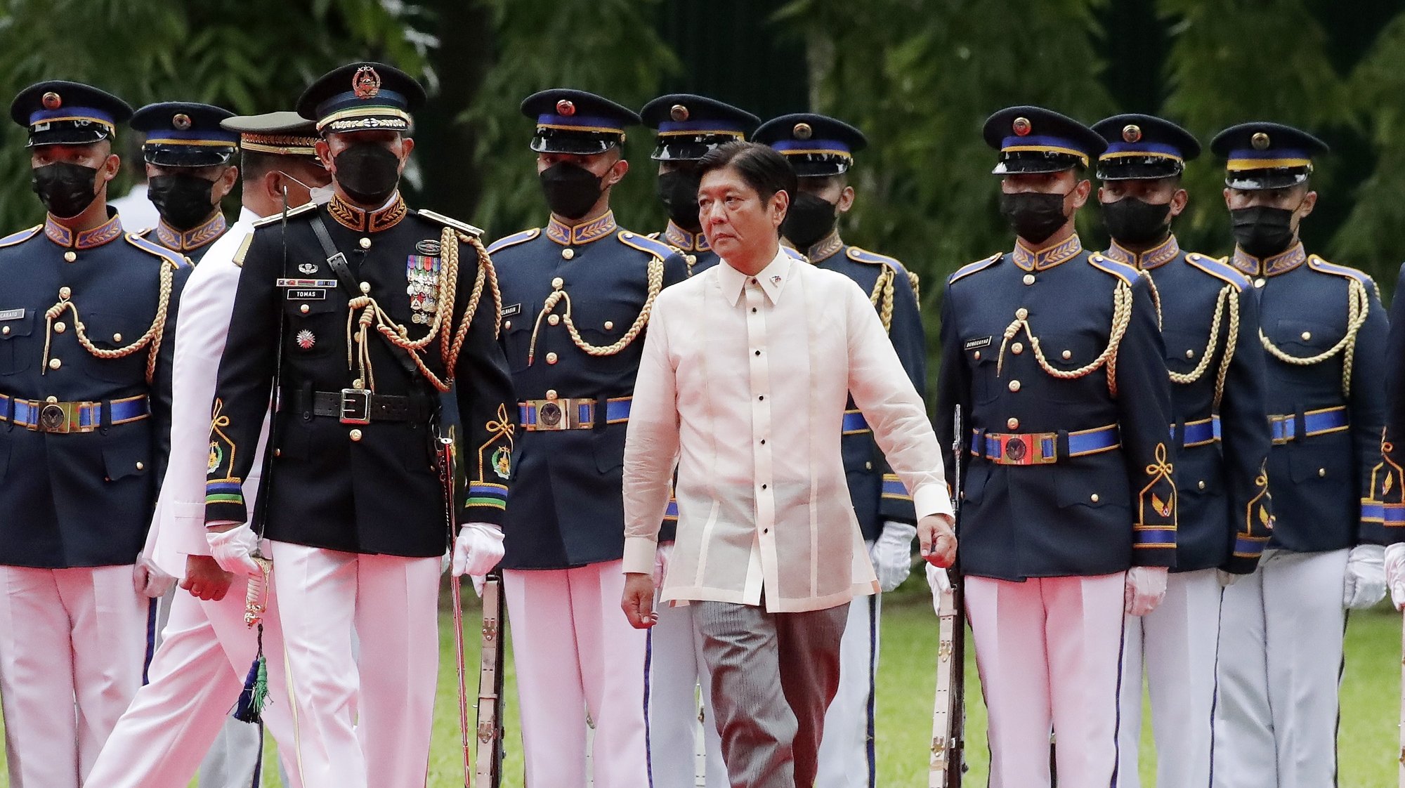 epa10042869 Philippines President-elect Ferdinand &#039;Bongbong&#039; Marcos Junior (C) reviews honor guards at the Malacanang presidential palace grounds in Manila, Philippines, 30 June 2022. Ferdinand &#039;Bongbong&#039; Marcos, the son of the late president Ferdinand Marcos is the 17th Philippine head of state.  EPA/FRANCIS R. MALASIG