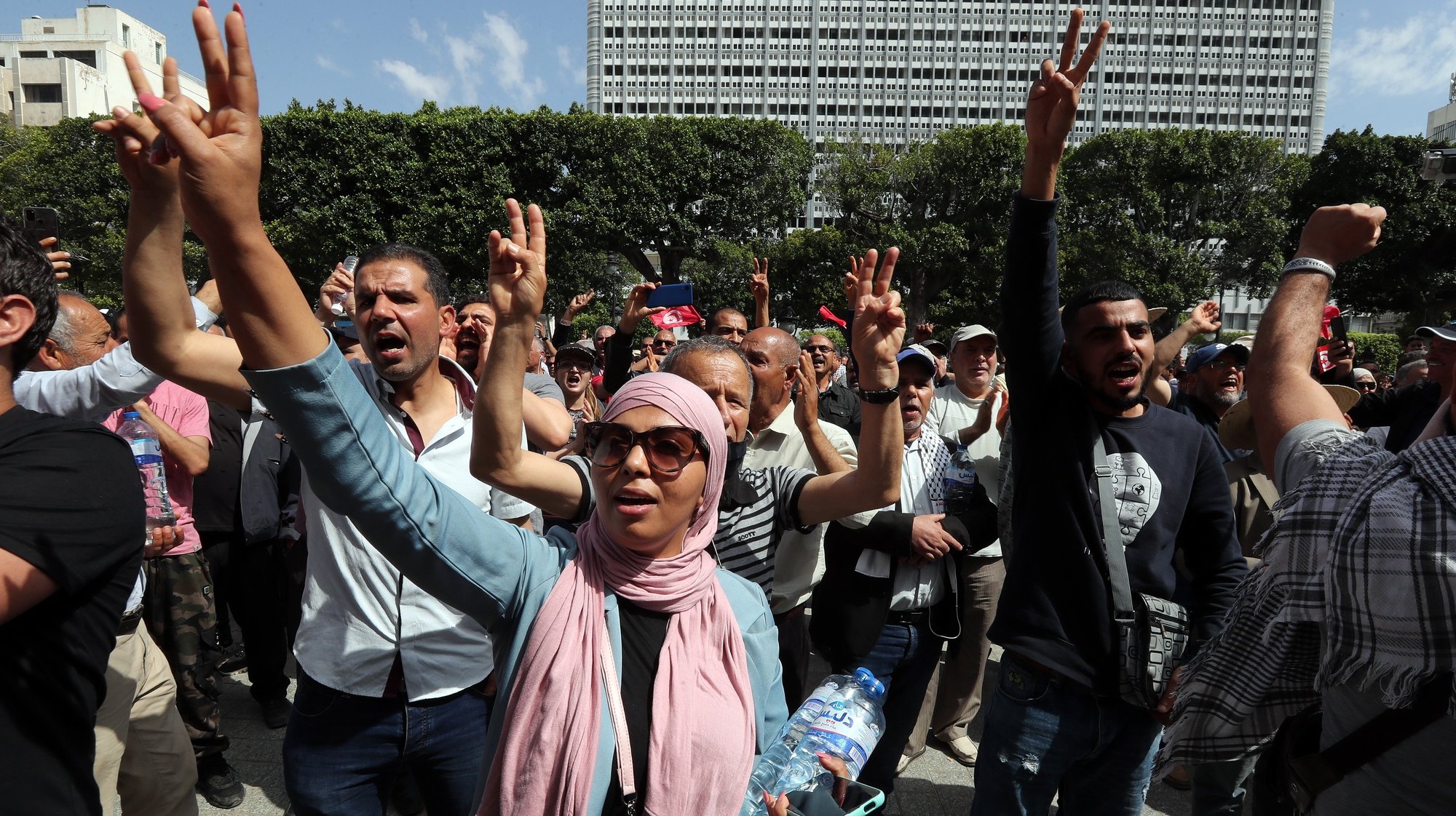 epa09948355 Tunisians shout slogans during a demonstration against Tunisian President Kais Saied in Tunis, Tunisia, 15 May 2022. Tunisians protest against the latest measures taken by President Kais Saied, which they describe as a coup.  EPA/MOHAMED MESSARA