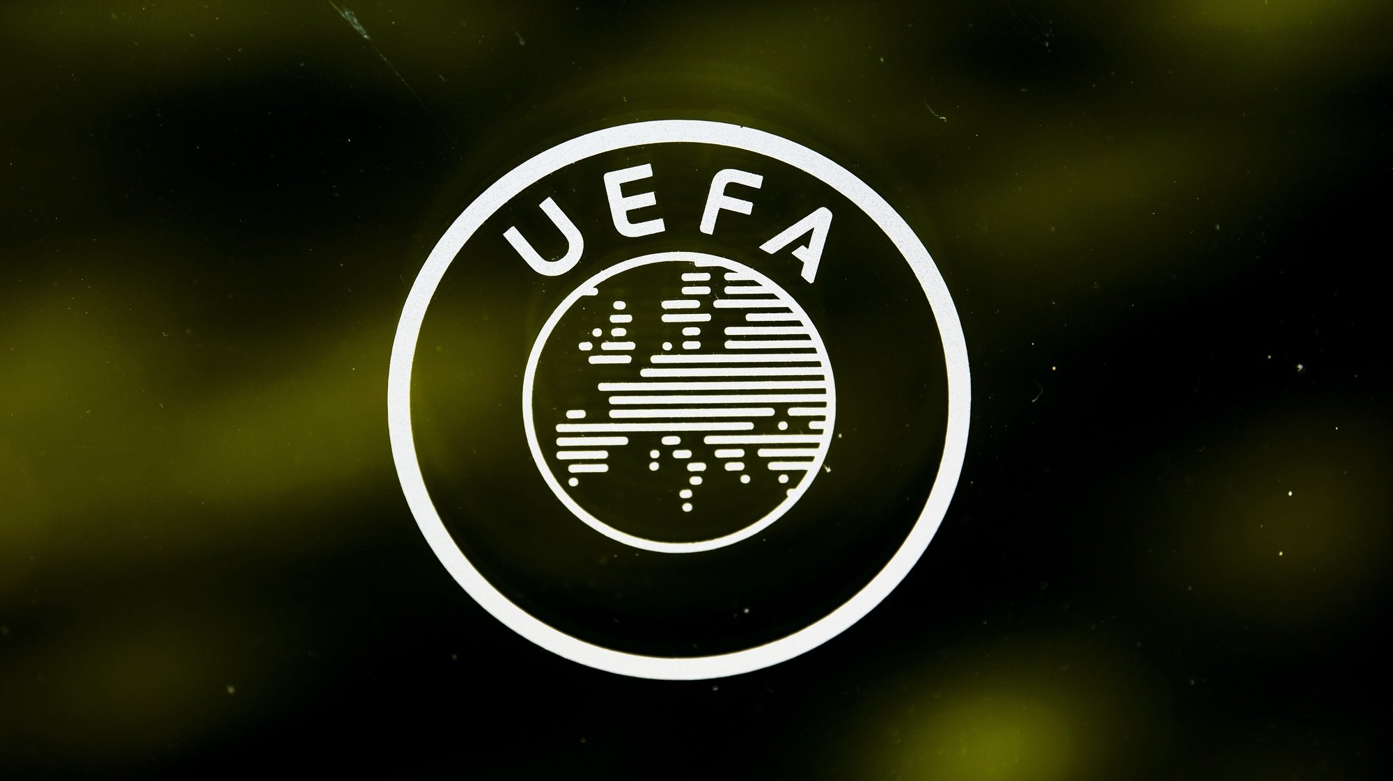 epa08389061 (FILE) - A UEFA logo is pictured through a window prior to the UEFA Europa League 2019/20 Round of 16 draw, at the UEFA Headquarters in Nyon, Switzerland, 28 February 2020 (re-issued on 28 April 2020). UEFA has given 25 May 2020 as a deadline date to European Leagues to decide wether to cancel or restart their seasons after the suspension amid COVID-19 coronavirus pandemic. UEFA&#039;s president Aleksander Ceferin explained that &#039;National Associations and/or Leagues should communicate to UEFA by 25 May 2020 the planned restart of their domestic competitions&#039;. In case of cancelation &#039;UEFA would require the National Association to explain the special circumstances justifying such premature termination and to select clubs for the UEFA club competitions 2020/21 on the basis of sporting merit in the 2019/20 domestic competitions&#039;.  EPA/JEAN-CHRISTOPHE BOTT *** Local Caption *** 55997733
