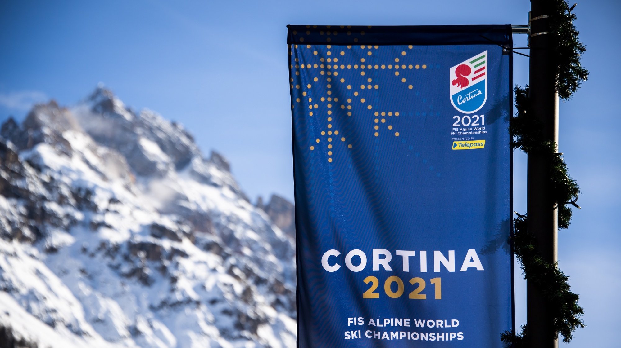 epa08989079 A banner with the logo Cortina 2021 is pictured in Cortina d&#039;Ampezzo, Italy, 05 February 2021. The 2021 FIS Alpine World Ski Championships will be held in Cortina d&#039;Ampezzo from 07 to 21 February 2021.  EPA/JEAN-CHRISTOPHE BOTT