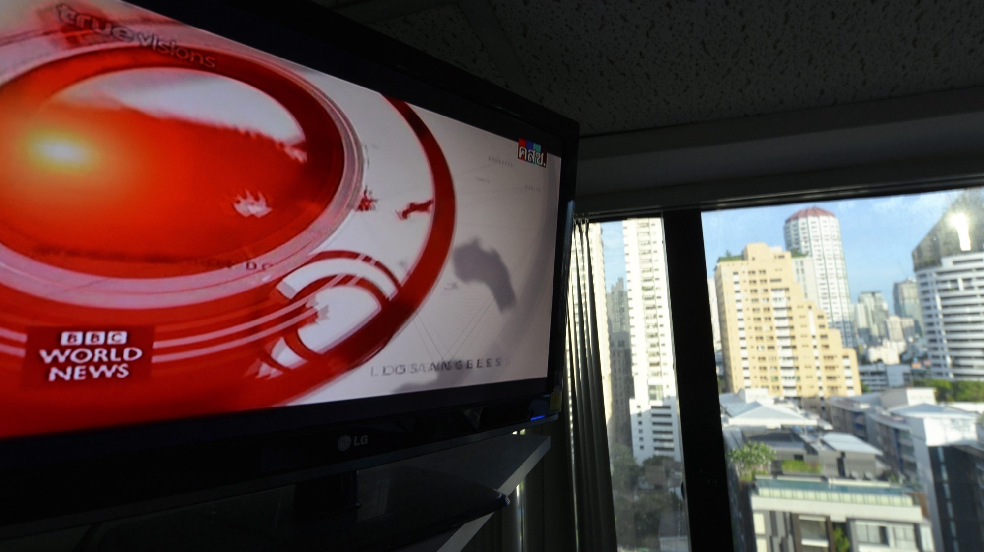 epa04237136 The logo of the BBC World News is seen on a TV screen in a high rise office building in Bangkok, Thailand, early 03 June 2014. The Thai military unblocked international TV news channels like BBC and CNN on 03 June after they were taken off the air in the country when the military took over power on 22 May. Royal Thai Army chief General Prayuth Chan-ocha seized power on 22 May, saying the coup was necessary to restore order after more than six months of street protests resulting in terrorist attacks and a political gridlock. On 30 May he vowed to appoint a prime minister once peace is restored, to enact political reforms and hold elections within about 14 months.  EPA/UDO WEITZ