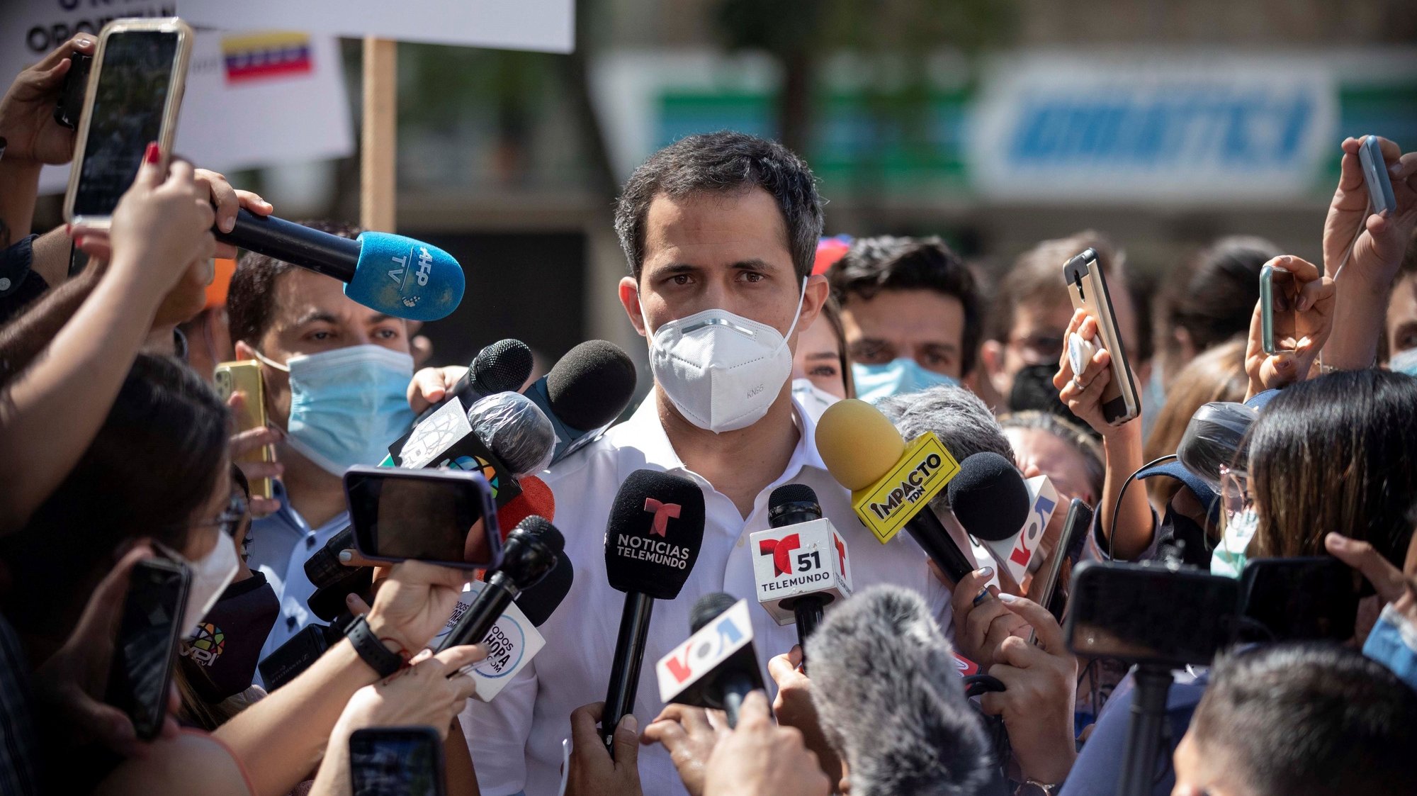 epa08880176 Venezuelan opposition leader Juan Guaido speaks to the media to refer to the popular consultation that he promotes and whose voting day is carried out in person in the country, in Caracas. Venezuela, 12 December 2020. The face-to-face voting points for the consultation promoted by Guaido in rejection of the past legislative elections opened in different parts of the country, after five days in which citizens were able to do so virtually. The voting began on 07 December virtually through two applications, Voatz and Telegram, a format that remains open until the end of 12 December.  EPA/Rayner Pena R.