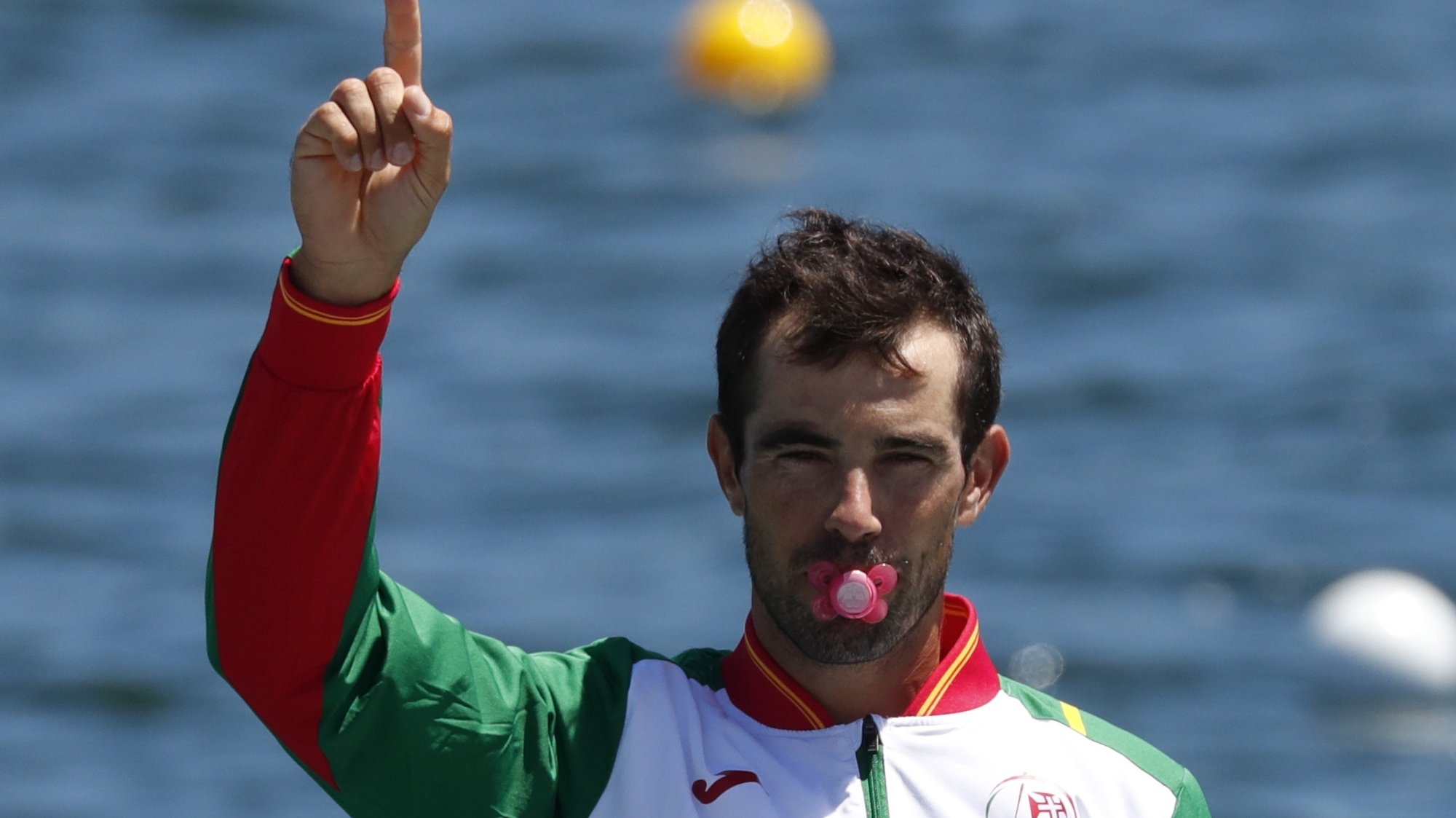 epa09390064 Bronze medalist Fernando Pimenta of Portugal puts a pacifier in his mouth during the Men&#039;s Kayak Single 1000m awarding ceremony at the Tokyo 2020 Olympic Games at the Sea Forest Waterway in Tokyo, Japan, 03 August 2021.  EPA/KIYOSHI OTA