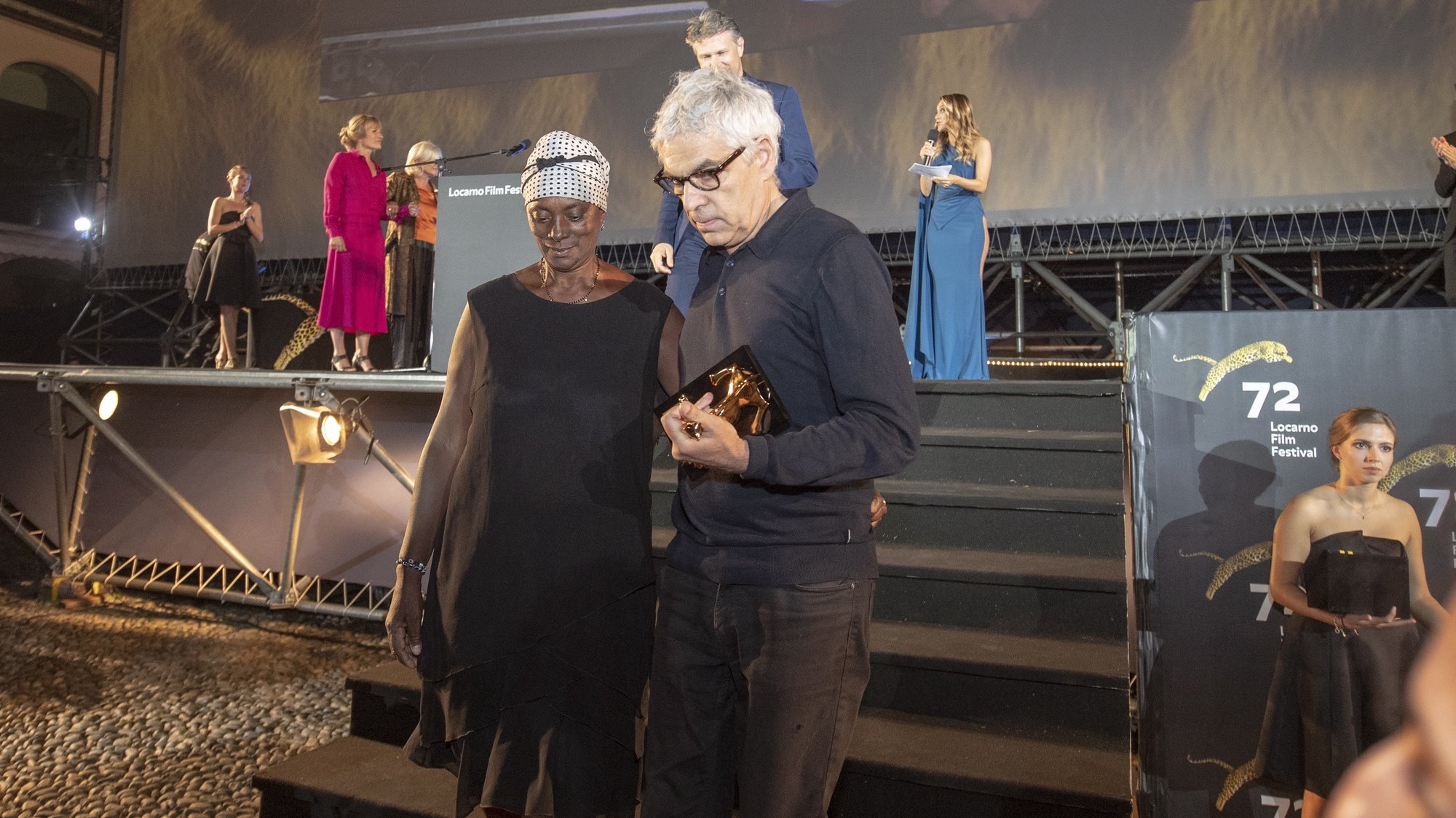 epa07778555 Film Director Pedro Costa (R) from Portugal with the &#039;&#039;Pardo d&#039;oro&#039;&#039; trophy for the best Film with actress Vitalina Varela from Cabo Verde for the &quot;best actress&quot; from the Film &quot;Vitalina Varela &quot; on the Piazza Grande at the 72th Locarno International Film Festival in Locarno, Switzerland, 17 August 2019. The Festival del film Locarno runs from 07 to 17 August 2019.  EPA/URS FLUEELER