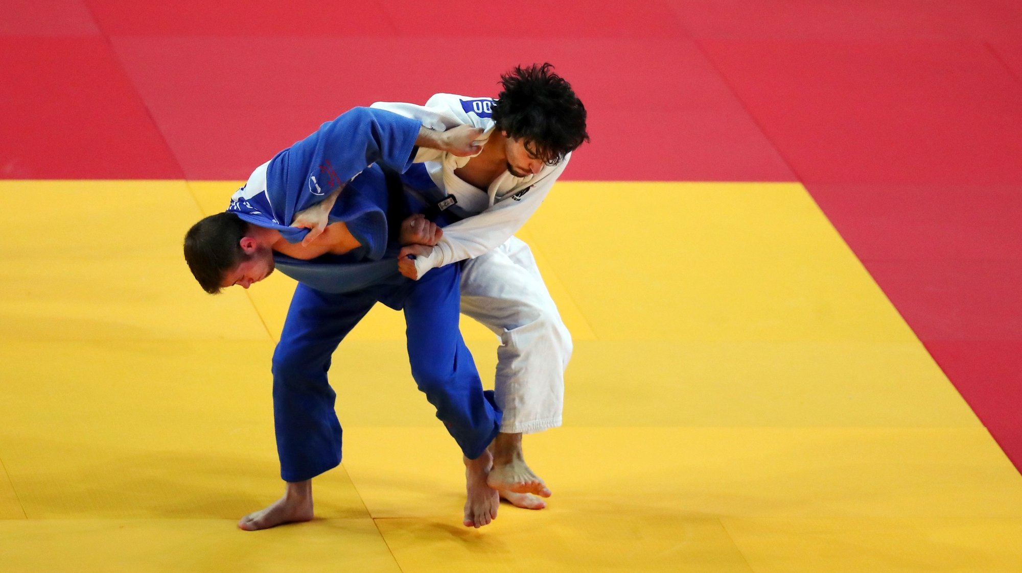 João Fernando of Portugal (white) and Martin Hojak of Slovenia (blue), in action during second round match in the men&#039;s -73kg category at the European Judo Championships in Lisbon, Portugal, 17 April 2021. NUNO VEIGA/LUSA