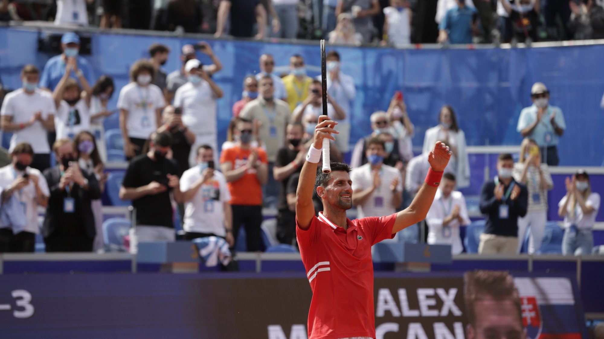 epa09234948 Novak Djokovic of Serbia celebrates after winning his final match against Alex Molcan of Slovakia at the Belgrade Open tennis tournament in Belgrade, Serbia, 29 May 2021.  EPA/ANDREJ CUKIC