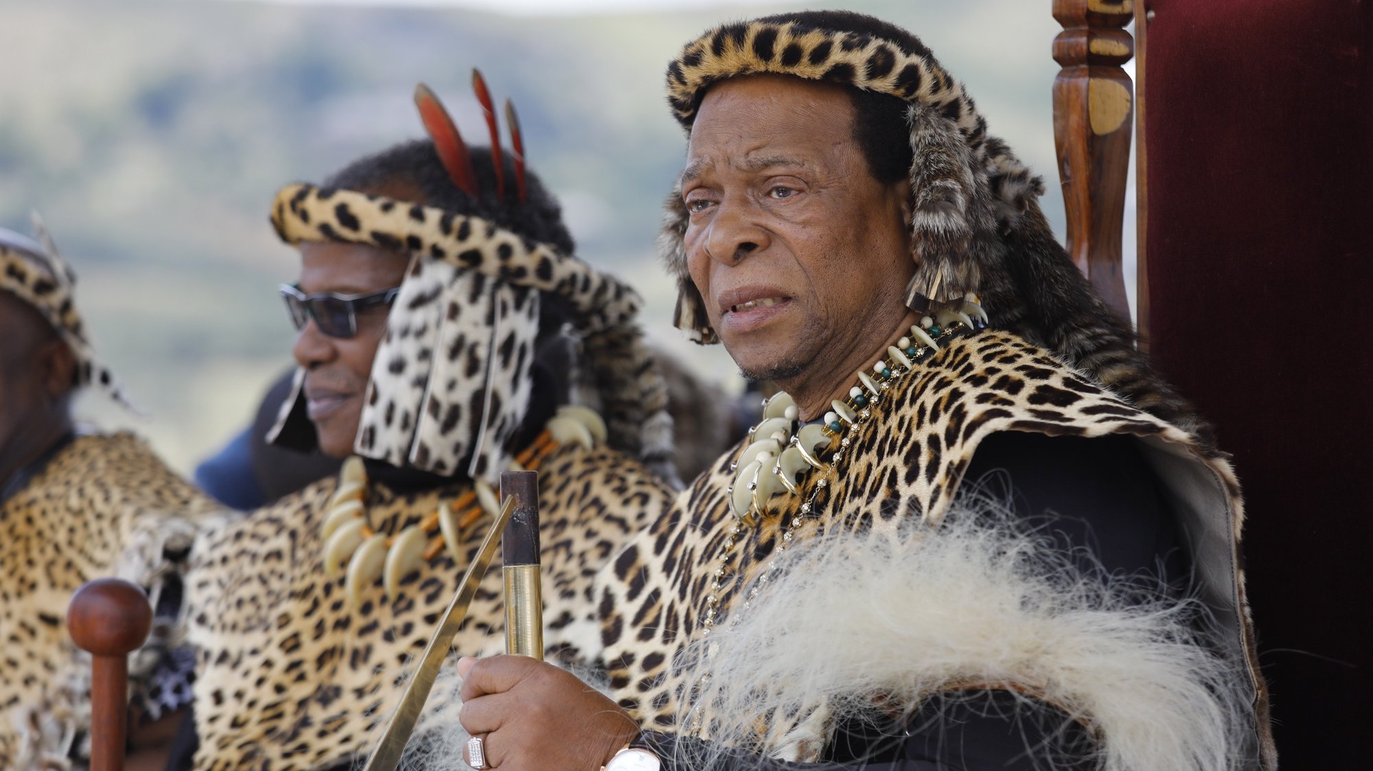 epa07318614 Zulu King Goodwill Zwelithini (R) watches members of a re-enactment group perform as Zulu warriors and British Soldiers during the 140th anniversary re-enectment of the Battle of Isandluana in Dundee, South Africa, 25 January 2019. The battle happened during the Anglo-Zulu Wars in 1879 and was the first between the Zulu nation and the British. 20,000 Zulu&#039;s attacked 1,800 British soldiers. The Zulu&#039;s ultimately overwelmed the British and won the battle.  EPA/KIM LUDBROOK