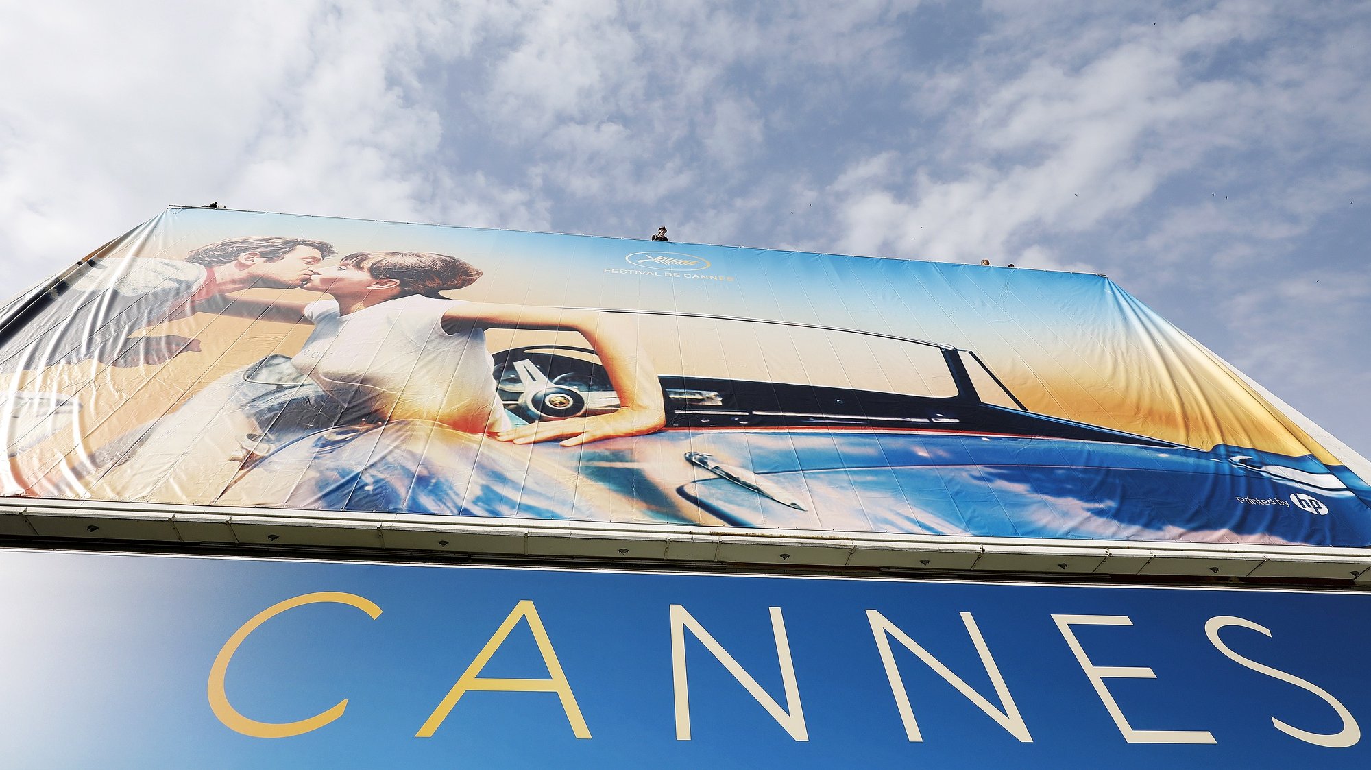 epa08307973 (FILE) - Workers set up the official poster of the 71st annual Cannes Film Festival on the Palais des Festivals facade, in Cannes, France, 06 May 2018 (reissued 19 March 2020). According to media reports, the Cannes Film Festival 2020 was cancelled, organizers announced on 19 March 2020, over the spread of the SARS-CoV-2 coronavirus causing the Covid-19 disease. The 73rd annual Cannes International Film Festival was due to take place from 12 to 23 May 2020.  EPA/SEBASTIEN NOGIER *** Local Caption *** 54311424