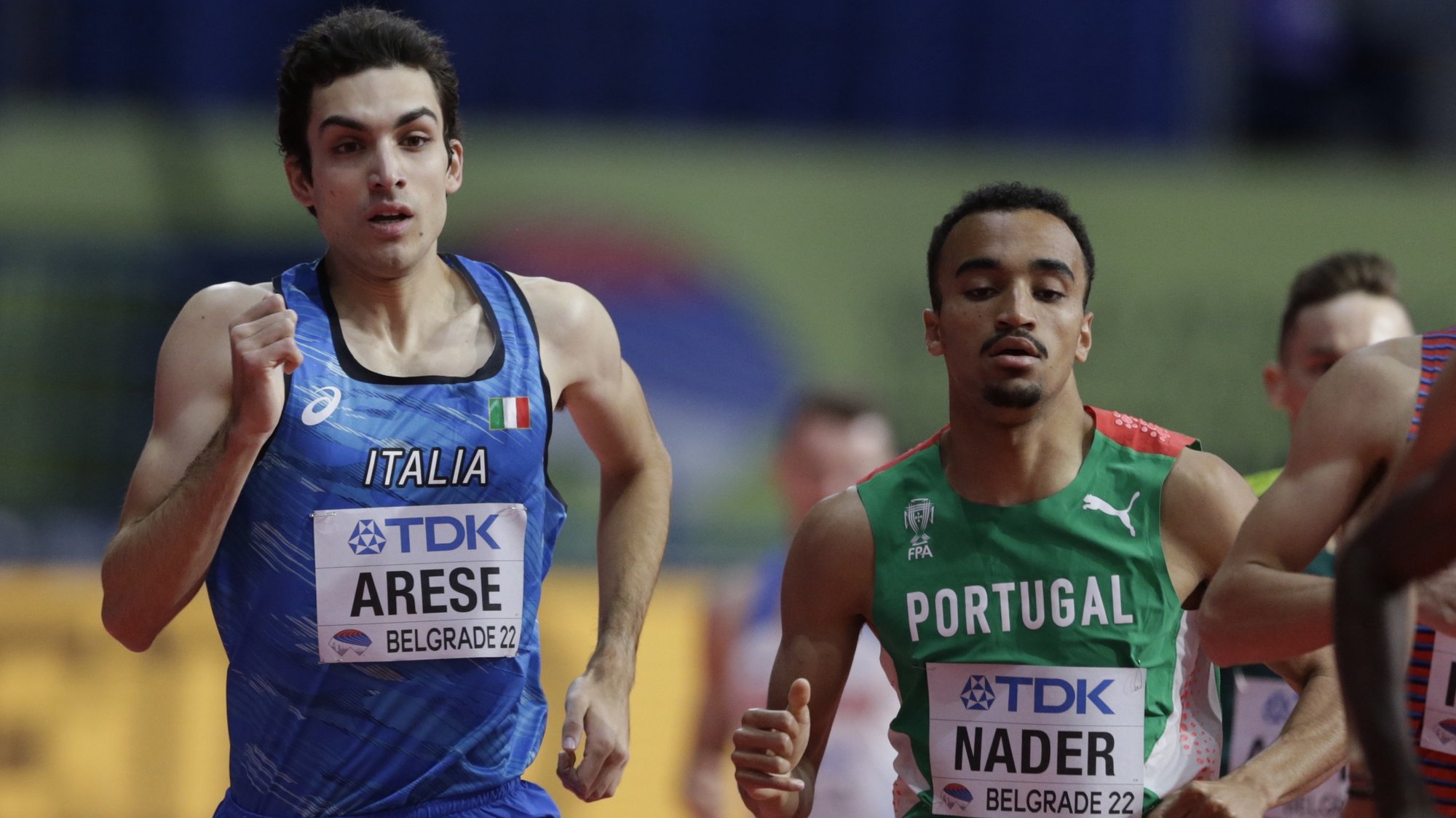 epa09835695 Pietro Arese of Italy (L) and Isaac Nader of Portugal (R) compete in the men’s 1500m heats at the World Athletics Indoor Championships in Belgrade, Serbia, 19 March 2022.  EPA/ANDREJ CUKIC