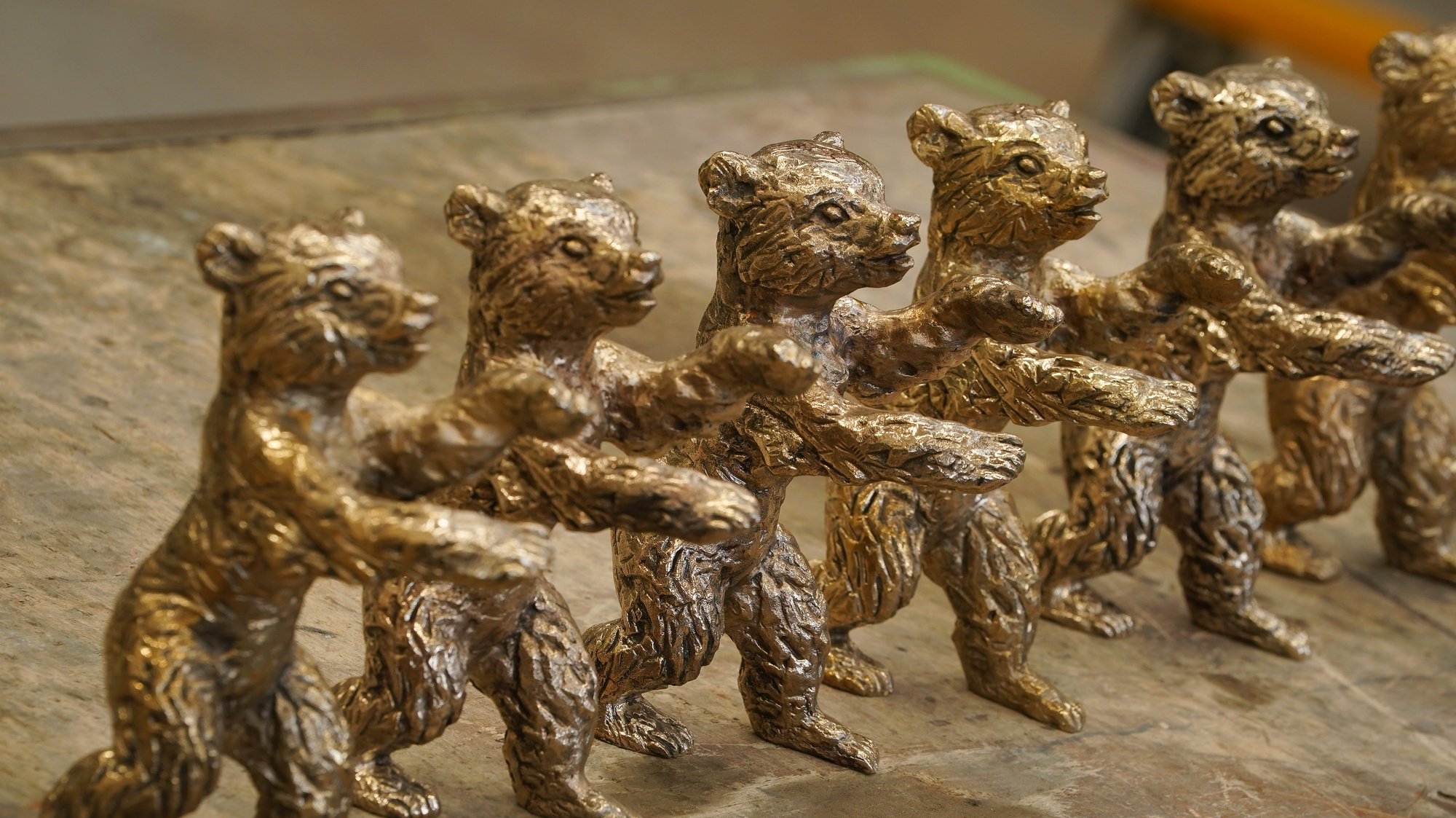 epa09018243 Nearly-finished Berlinale bear trophies for the 71st Berlin International Film Festival stand in a workshop at the Hermann Noack Bildgiesserei foundry in Berlin, Germany, 17 February 2021. Due to the ongoing coronavirus Covid-19 pandemic, the 2021 Berlinale will be split into two stages. From 01 through 05 March 2021, the festival will hold an online-only event mainly for the international industry. An in-person festival is planned for 09-20 June 2021.  EPA/Sean Gallup / POOL