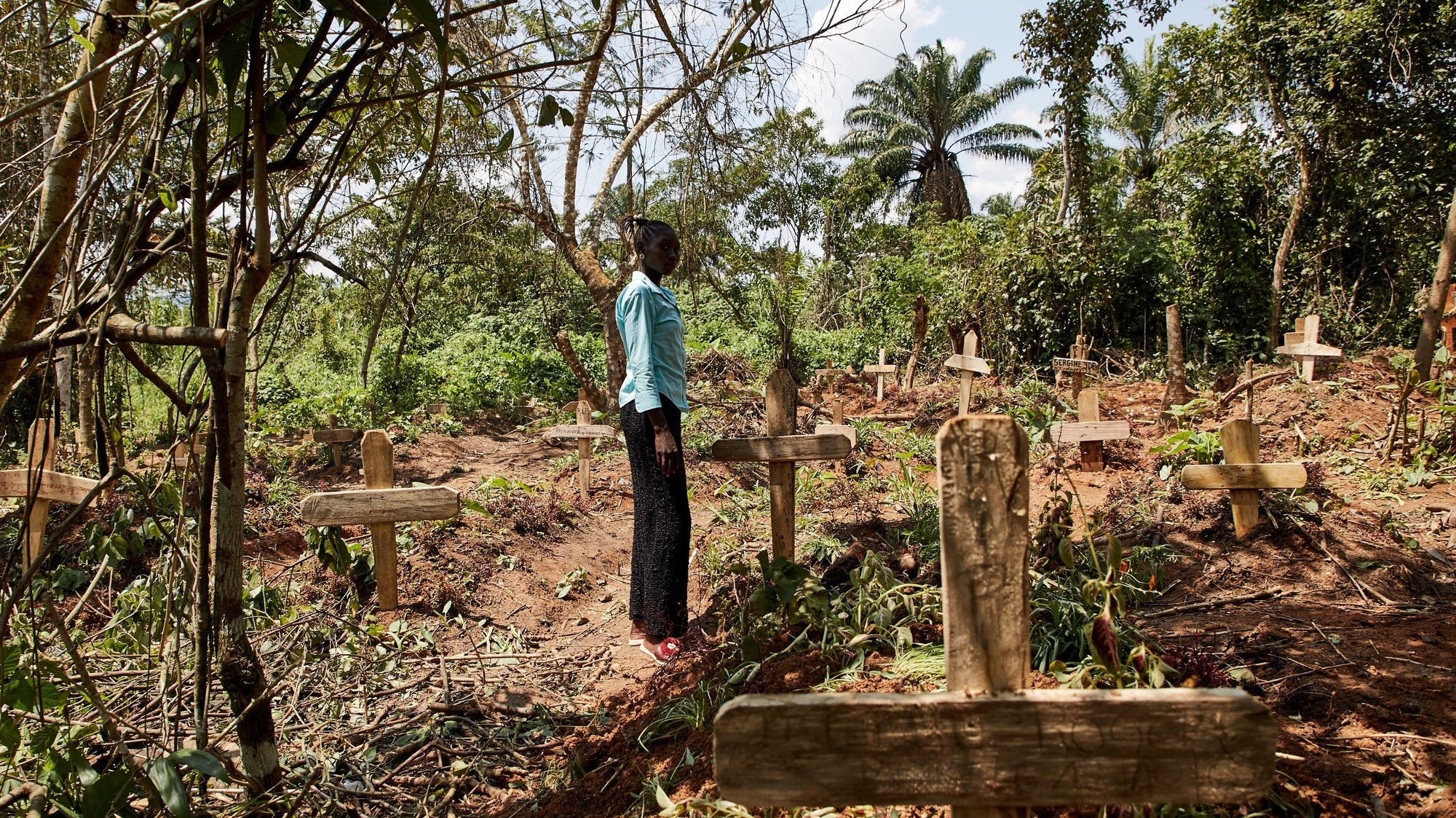 epaselect epa08891328 (19/39) Yvette Adaniya, an Ebola survivor, visits and pays her respects to the grave of her husband at a specially designated site for burials of Ebola victims, to the North of Beni, North Kivu, Democratic Republic of Congo, 14 October 2020. ‘The devil will not distract us again,&#039; says Adaniya, who lost her husband to the virus as this unfamiliar disease broke out in the forests to the North of Beni, North Kivu. &#039;When I had Ebola, my whole body and soul were affected. I lost weight and became bruised and black. I was throwing up, with diarrhea and headaches. 
I feel like I am recovered, but I don’t have any strength like before. My body became weak, not like it used to be. 
In my family, it killed 2 people, my husband, and my brother-in-law. 
When it arrived in the village, we got infected at the health center, my husband was ill [with another sickness] so we took him to the health center nearest the village. We shared the same room with a person affected by Ebola, who was about to be collected by an ambulance. 
We weren’t sure what it was, yes they would tell us it was Ebola, but this disease was like a demon, we did not listen to the information, we thought it was about politics, not a disease. We did not rush to the health center; rumors spread that people don’t leave the health center: that [our ethnic group] Nande, would never leave there. 
Advice for people suffering with this Corona, Covid-19. We need to be flexible, washing hands, use hygiene. The devil will not distract us again, we were like fools, and we did not listen. This time we need to be flexible to follow and respect what  doctors say.&#039;  EPA/Hugh Kinsella Cunningham ATTENTION EDITORS / MANDATORY CREDIT : This story was produced in partnership with the Pulitzer Center -- For the full PHOTO ESSAY text please see Advisory Notice epa...