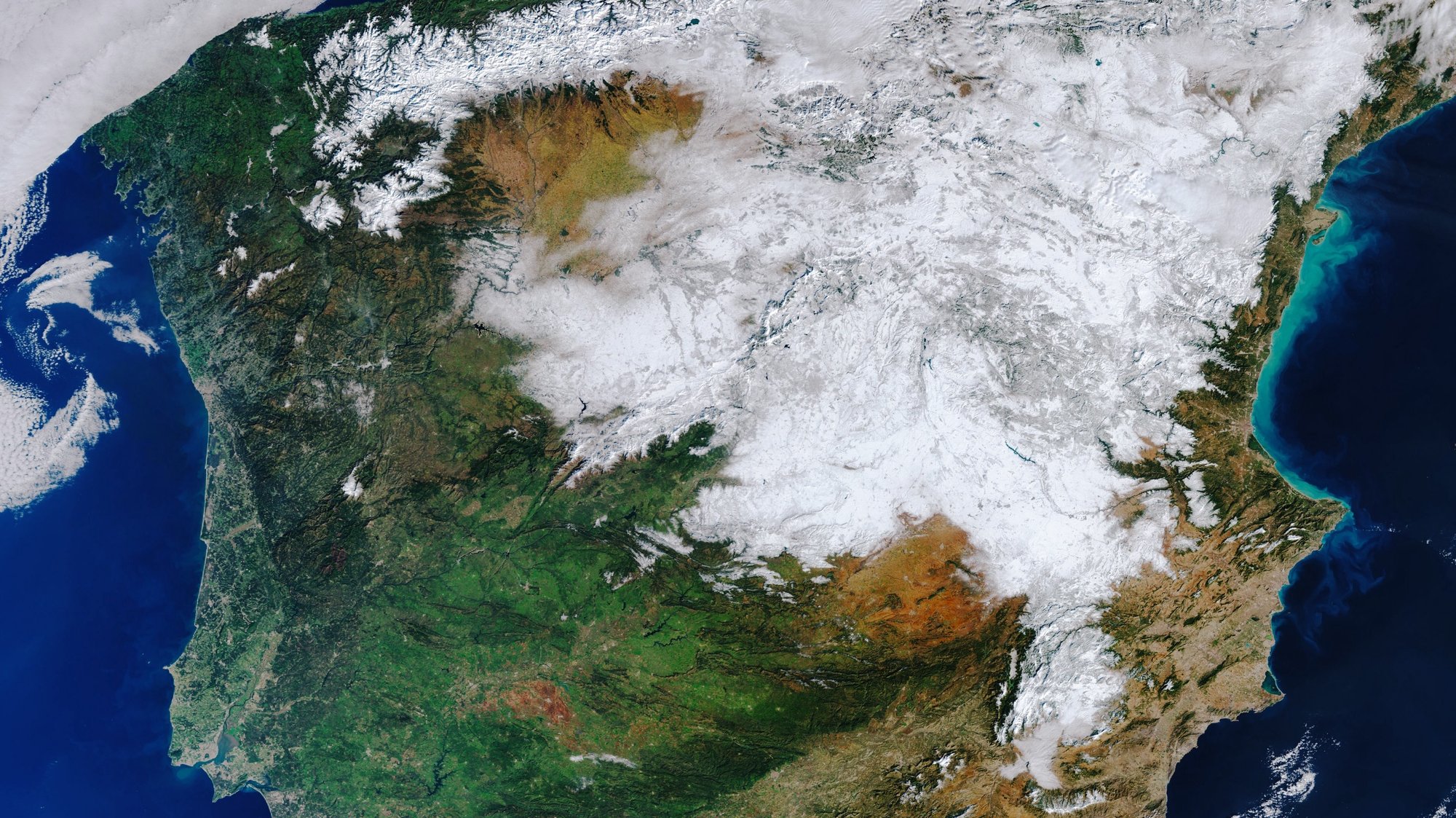 epa08936901 A handout picture made available by the European Space Agency (ESA) shows a satellite image captured by the Copernicus Sentinel-3 mission on 12 January 2021 of the heavy snowfall that hit Spain a few days ago still covering much of the country (issued 14 January 2021). Storm Filomena hit Spain between 07 and 09 January, covering a large part of the country in thick snow. Madrid one of the worst affected areas, was brought to a standstill with the airport having to be closed, trains cancelled and roads blocked.  EPA/EUROPEAN SPACE AGENCY HANDOUT -- contains modified Copernicus Sentinel data (2021), processed by ESA -- HANDOUT EDITORIAL USE ONLY/NO SALES