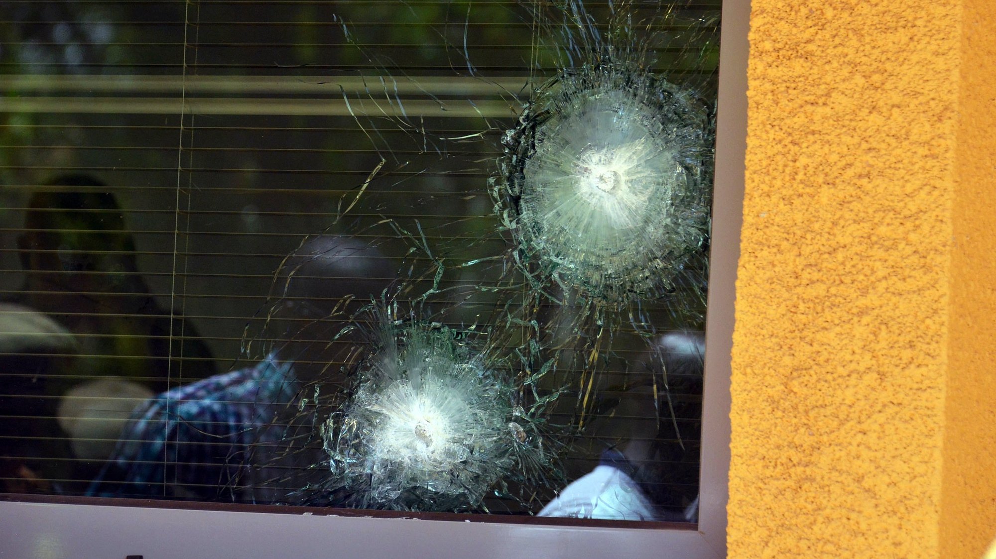 epa06577579 A bullet-shattered window at the French Embassy after an alleged terrorist attacks in the capital Ouagadougou, Burkina Faso, 03 March 2018. According to reports at least 28 people have been killed and dozens left wounded in the attacks on the French Embassy and miltary headquarters in Ouagadougou.  EPA/LEGNAN KOULA