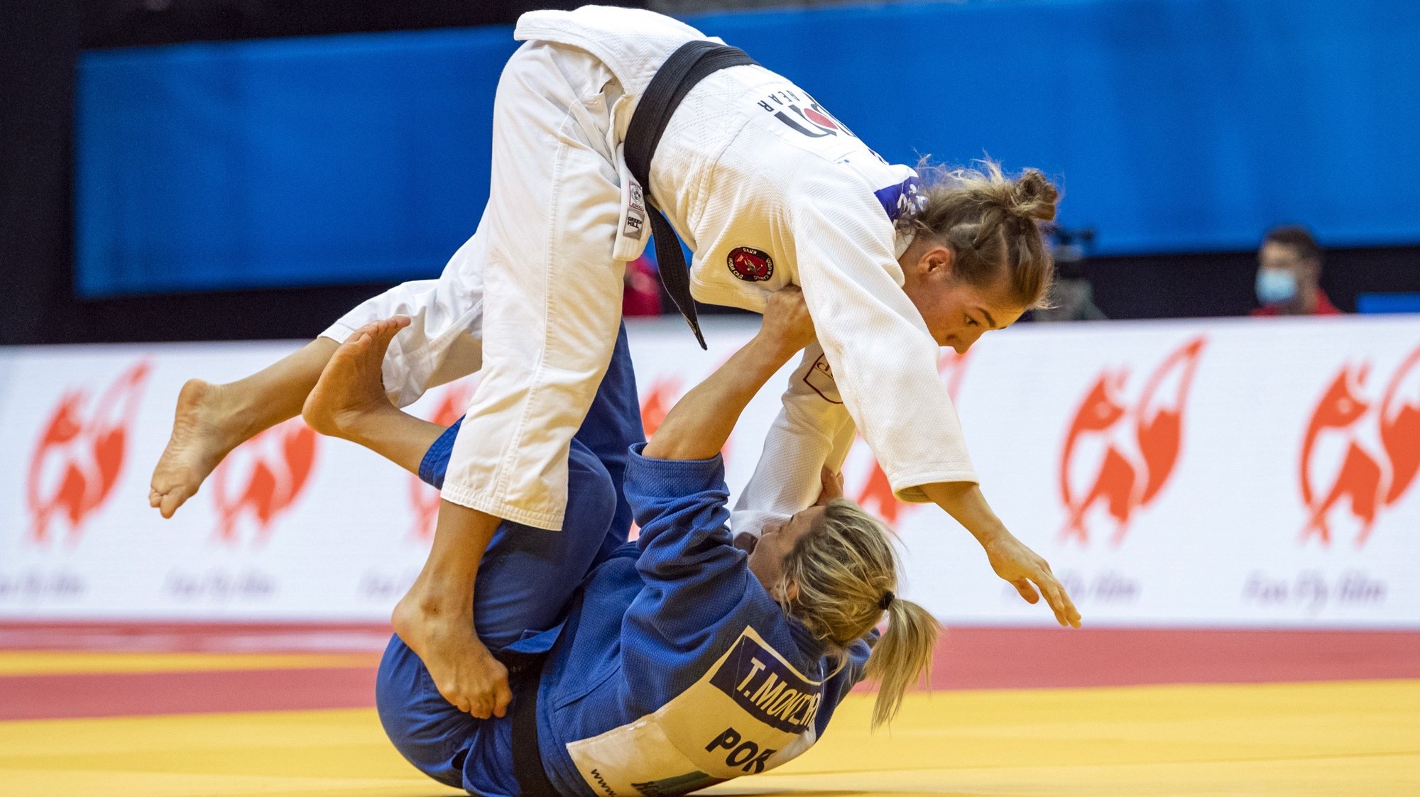 epa08829248 Marica Peresic of Serbia (top) and Telma Monteiro of Portugal (bottom) in action during the semifinal match in the women&#039;s -57kg category at the 2020 European Judo Championships in Prague, Czech Republic, 19 November 2020.  EPA/MARTIN DIVISEK