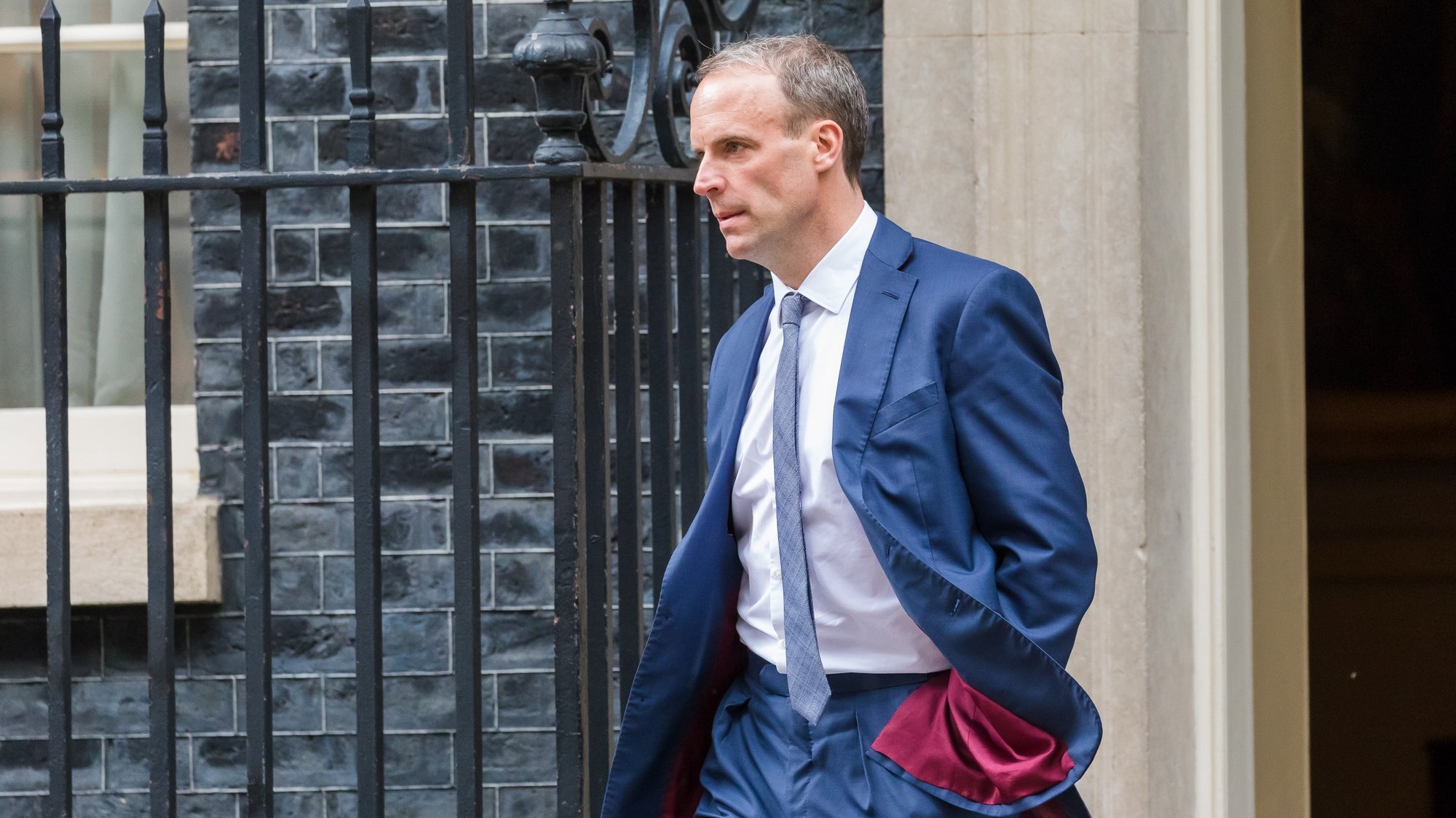 epa09231534 British Foreign Secretary Dominic Raab leaving 10 Downing Street in London, Britain, 27 May 2021. Prime Minister Johnson has rejected claims by his former closest adviser Dominic Cummings that government mistakes led to thousands of extra Covid deaths.  EPA/VICKIE FLORES